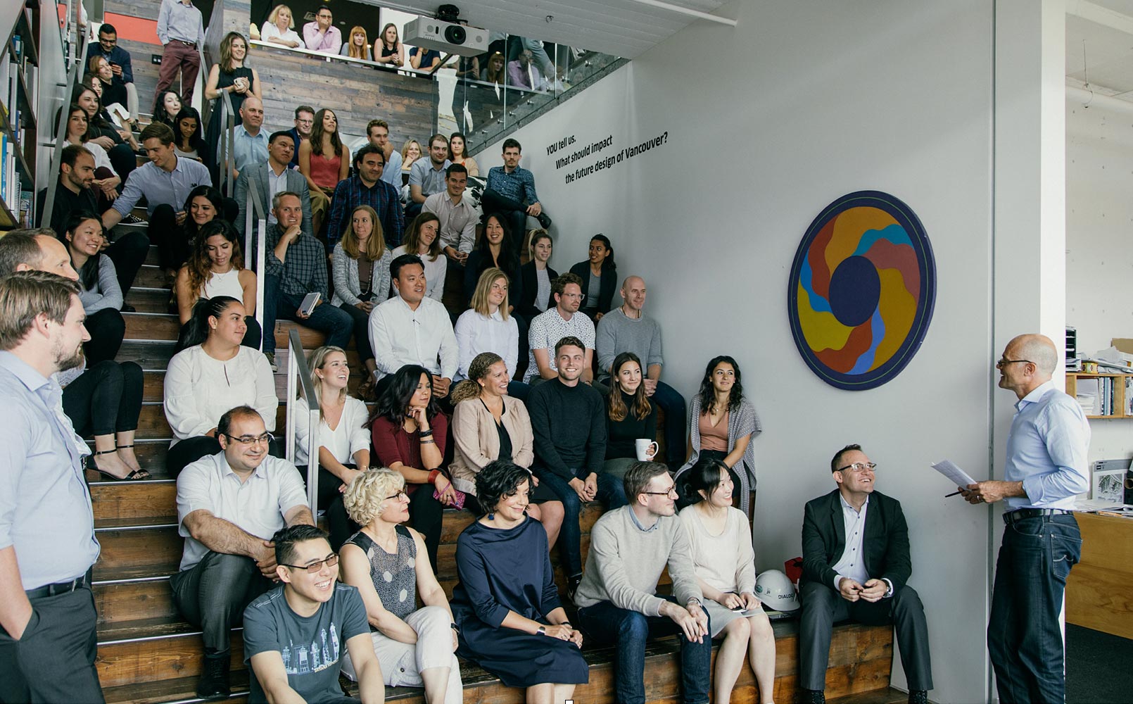 Martin at a staff meeting which he has been leading every month for a number of years now (always starting with a pop-culture, politically relevant video).